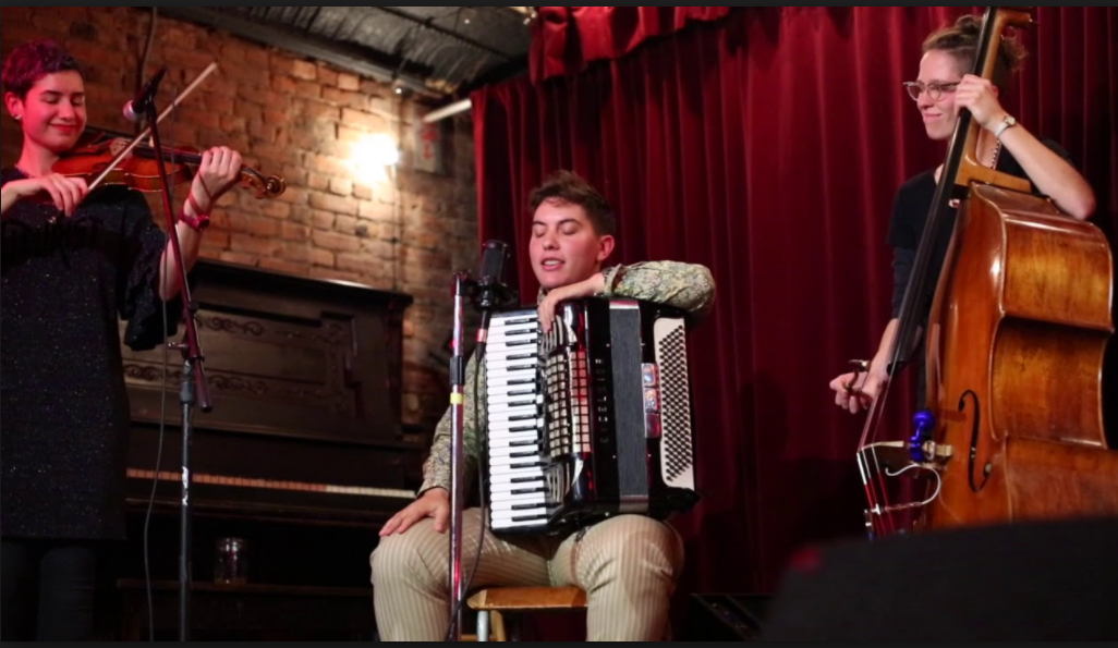 <p>Still from a perfomance of “Mir Veln Zey Iberlebn” (“We Will Outlive Them”) <a href="https://www.youtube.com/watch?v=pk_1pw70Qjc">via</a></p>