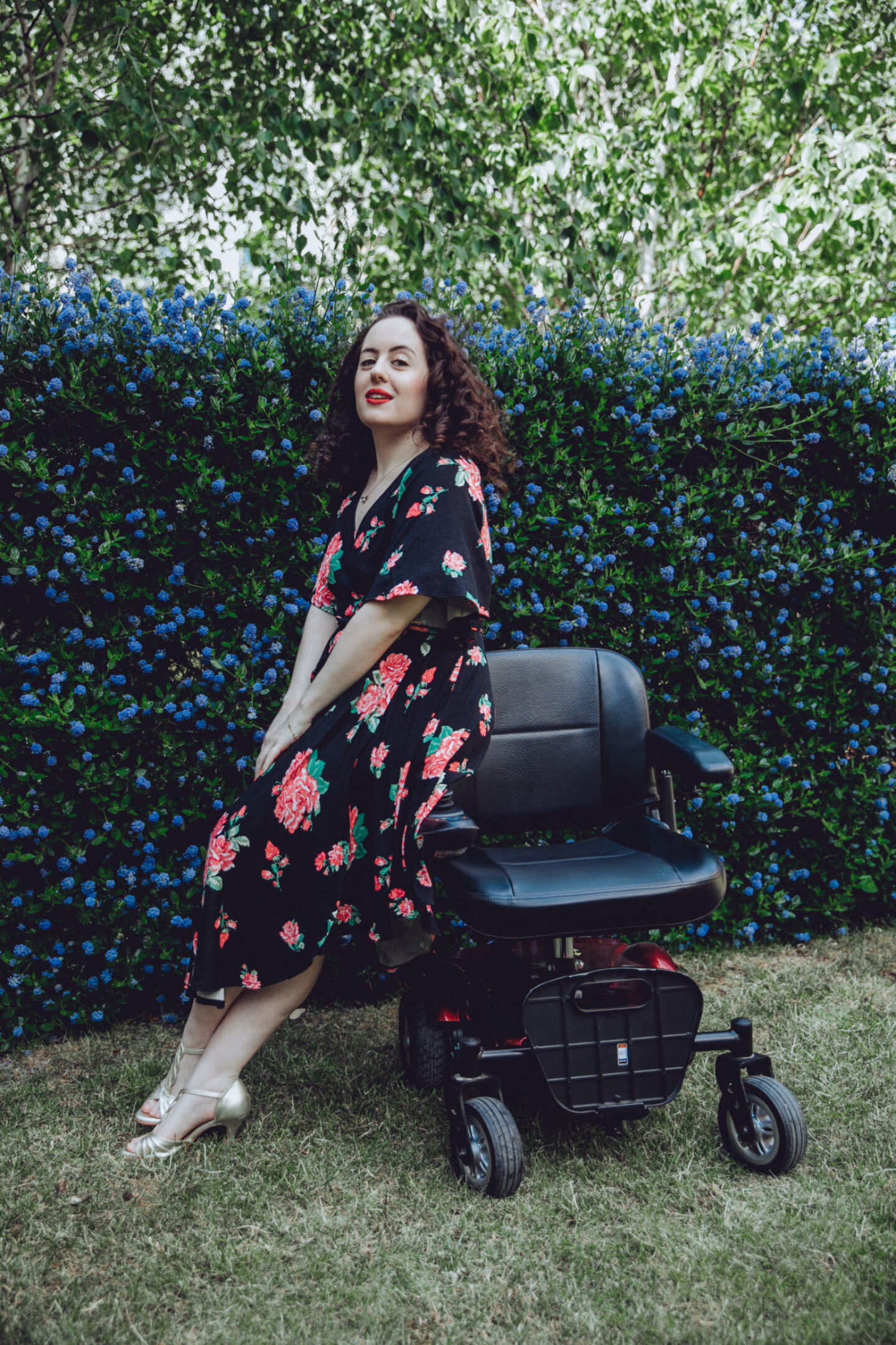 <p>The author Natasha Lipman in a garden with a wheelchair.</p>