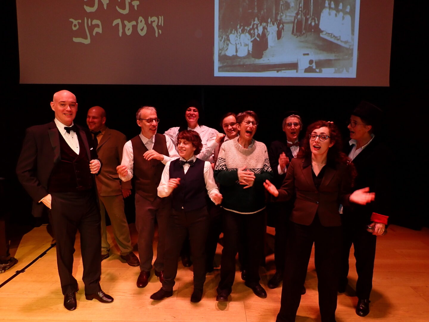 <p>Sonia Gollance (second from right) with cast of <em>Secrets of the London Yiddish Stage</em>, including Shane Baker (left), David Schneider (third from left), Tamara Micner (front fourth from left), and director Vivi Lachs (front fifth from left). Photo by Liam Lachs.</p>