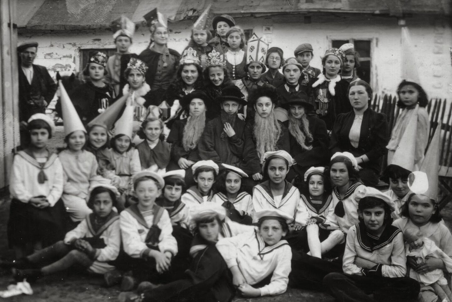 <p>A Purim celebration in Poland, 1939, just a few years after Manger’s <em>Megile</em> was published. Motl Didner of the Folksbiene Theatre specifically <a href="https://www.yiddishbookcenter.org/language-literature-culture/yiddish-literature/focus-itzik-manger">identifies</a> Manger’s book in the context of and as a commentary on European antisemitism preceding World War II. Image via USHMM.</p>