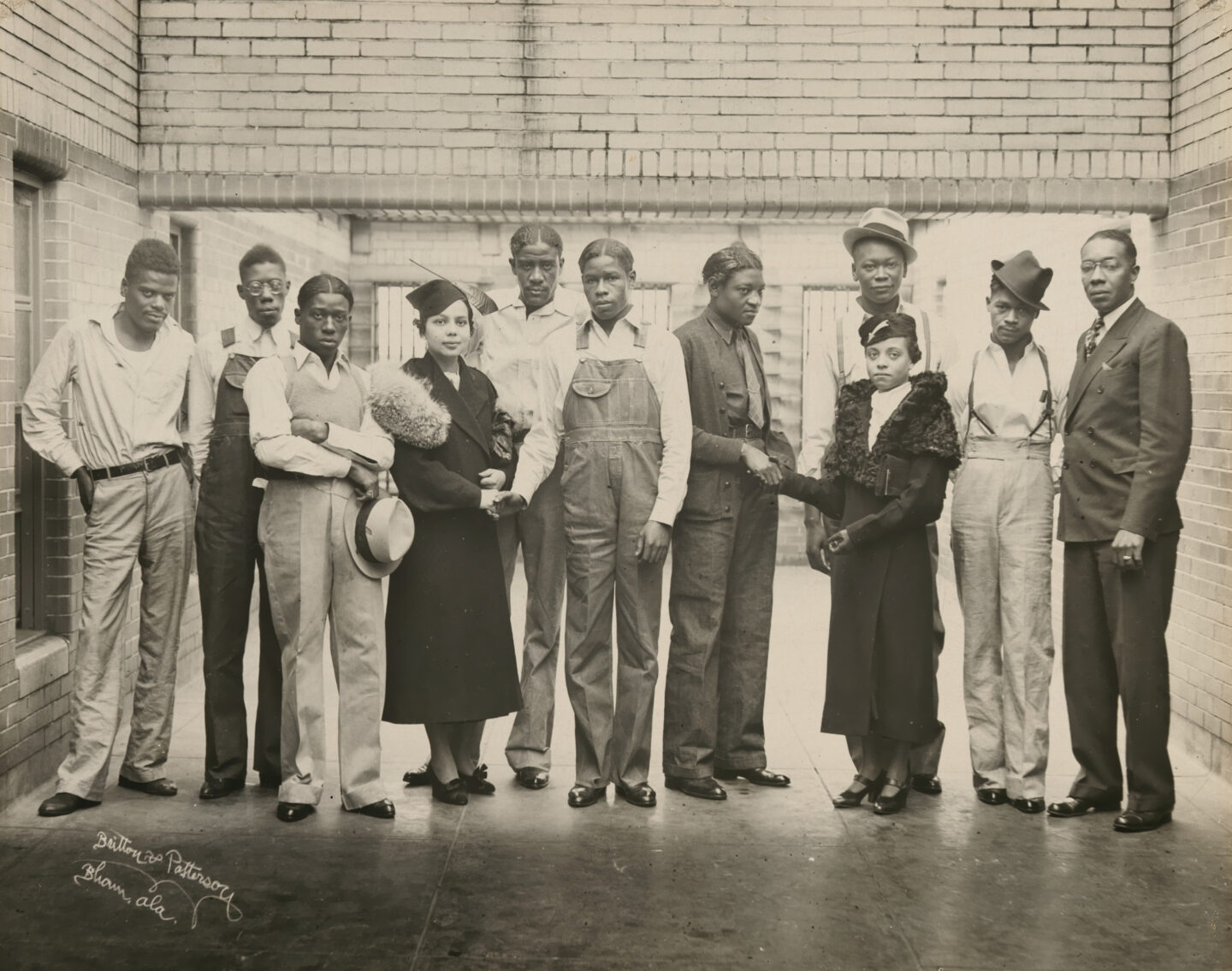 <p>Photograph of eight of the nine Scottsboro boys together with three NAACP representatives, 1936, in the prison where they were being held. Image via the National Portrait Gallery.</p>