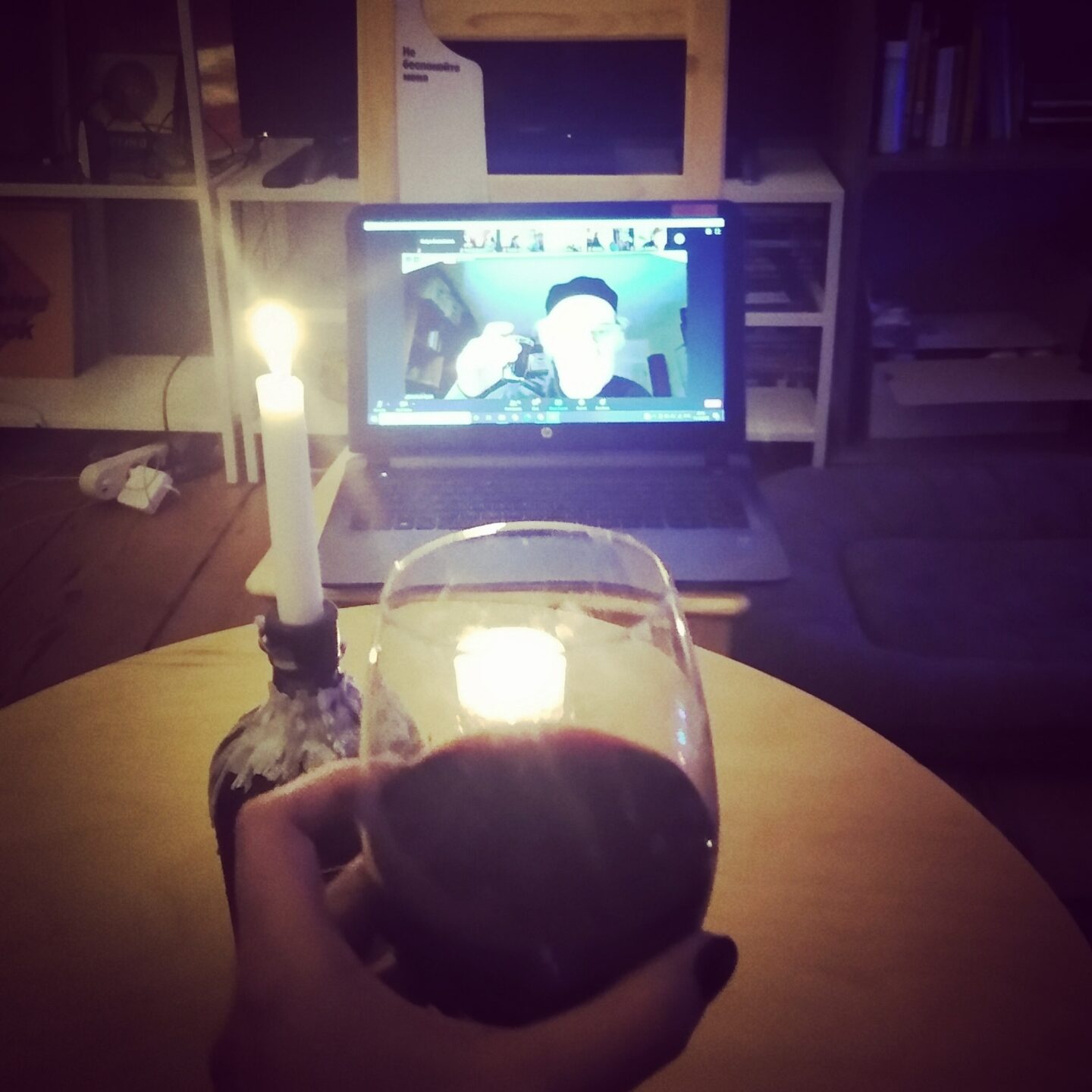 <p>Ekaterina Kuznetsova raises a glass with Michael Alpert at Shtetl Berlin’s online <em>shabes tish</em>. Photo by the author. </p>