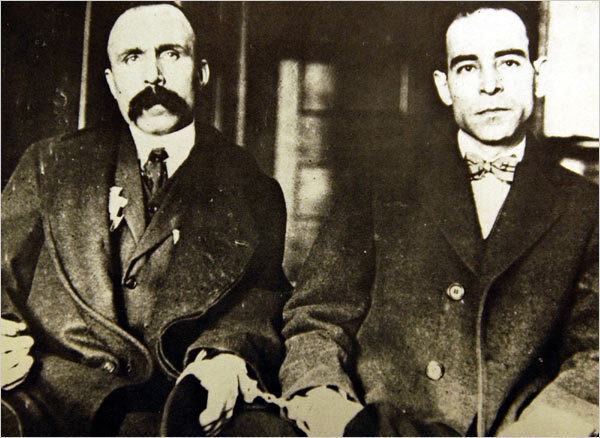 <p>Bartolomeo Vanzetti (left), handcuffed to Nicola Sacco (right). Dedham, Massachusetts Superior Court, 1923. (Boston Public Library)</p>