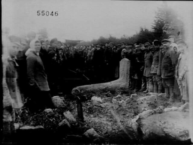 <p>“At a cemetery: people pose near a row of graves.” Photo courtesy of YIVO <a href="http://yivo1000towns.cjh.org/picture.asp?PictureSetID=4506&amp;ImageID=53642&amp;PictureSetIndex=117" target="_blank" rel="noreferrer noopener">People of a Thousand Towns</a> photo project. </p>