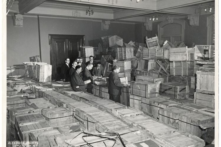 <p>Leaders of the New York-based YIVO open crates of salvaged materials from Europe in 1947 at the Manischewitz matzah warehouse in New Jersey. (YIVO Institute of Jewish Research)</p>