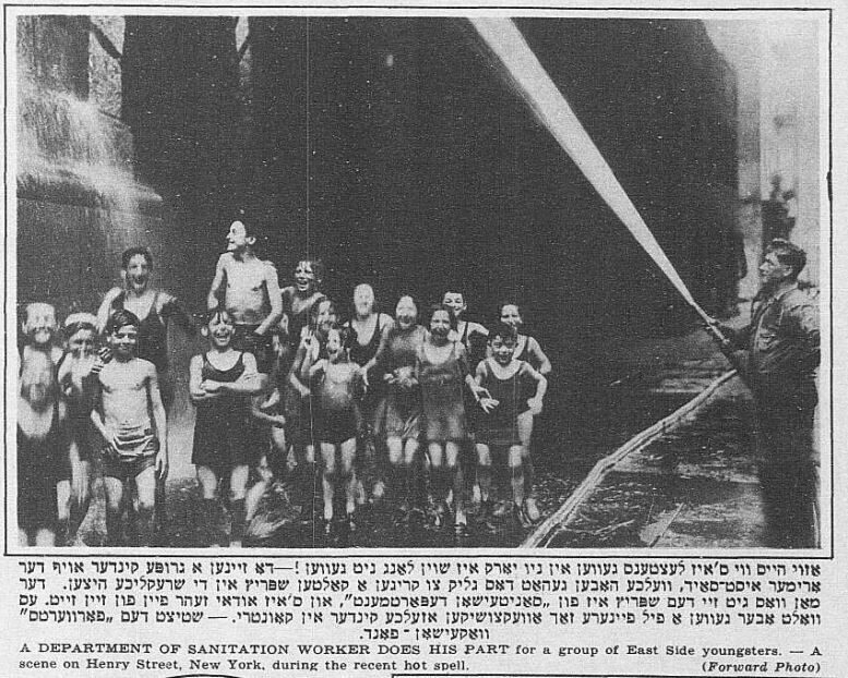 <p>A department of sanitation worker sprays water for East Side children to bathe in during a heat wave. Source: <em>Forverts</em>, July 15, 1934, via Historical Jewish Press collection, National Library of Israel.</p>